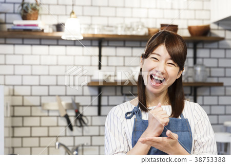 Cafe kitchen young woman working 38753388