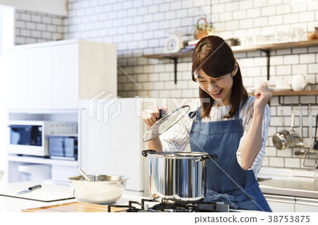 Cafe kitchen young woman working 38753875