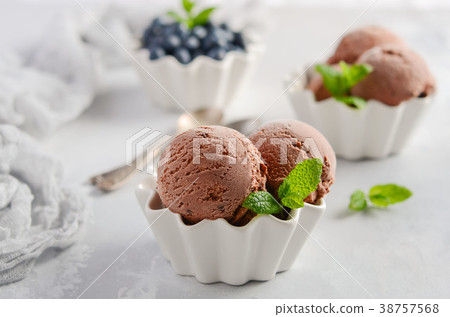 Chocolate ice cream with blueberries. Chocolate ice cream with blueberries. 38757568