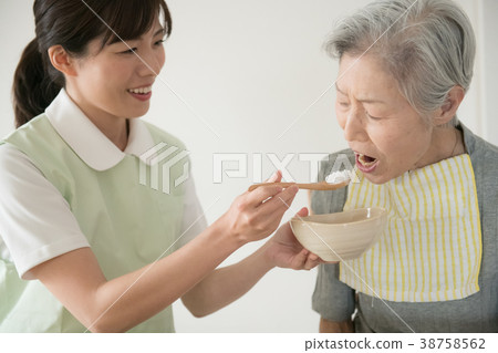 Meal assistance Senior woman and care worker 38758562