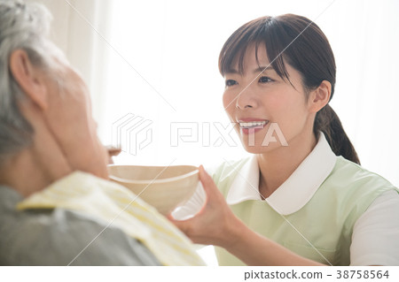 Meal assistance Senior woman and care worker 38758564