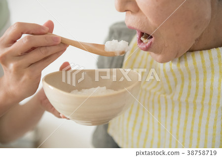 Meal assistance Senior woman and care worker 38758719