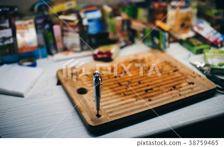 awl for piercing the foil for hookah on the table 38759465