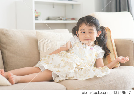 Little girl watching tv. Little girl watching tv. 38759667