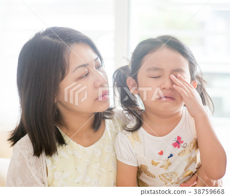 Mother comforts crying daughter. Mother comforts crying daughter. 38759668