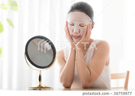 Young woman doing face mask beauty beauty Young woman doing face mask beauty beauty 38759977