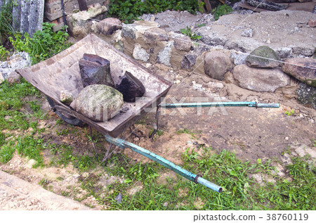 work place with barrow and stone in farm work place with barrow and stone in farm 38760119