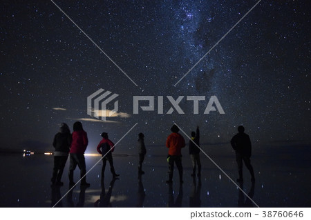 People looking up at the starry sky 38760646