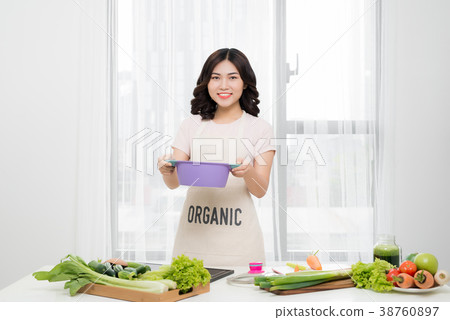 Healthy food. Asian woman cooking in the kitchen 38760897