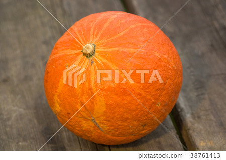 orange pumpkins over wooden table orange pumpkins over wooden table 38761413