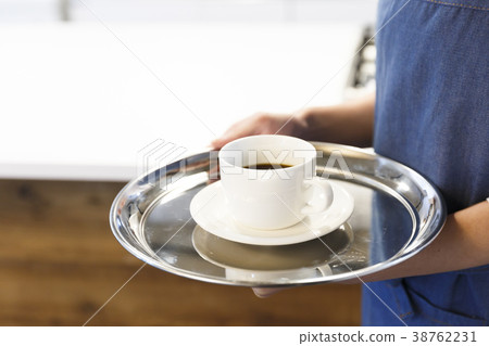 Cafe kitchen young woman working 38762231