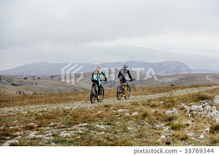 mountain trail two athlete cyclist mountain trail two athlete cyclist 38769344