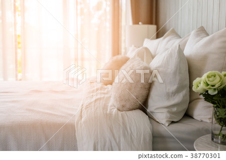 light soft pillow on beautiful bed cozy bedroom light soft pillow on beautiful bed cozy bedroom 38770301