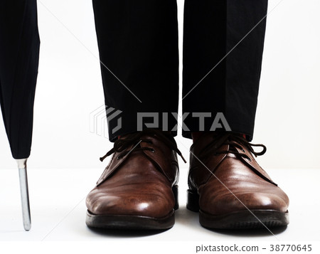 Stylish men's shoes and an umbrella Stylish men's shoes and an umbrella 38770645