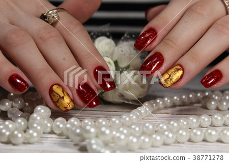 Women's hands with a stylish manicure. 38771278