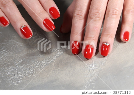 Women's hands with a stylish manicure. Women's hands with a stylish manicure. 38771313