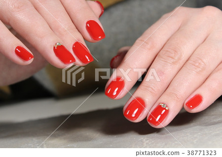 Women's hands with a stylish manicure. Women's hands with a stylish manicure. 38771323