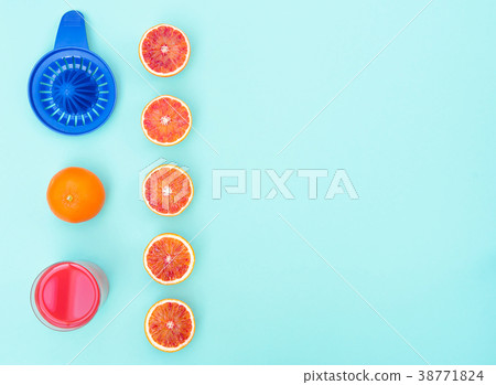 Glass with fresh made blood orange juice on 38771824