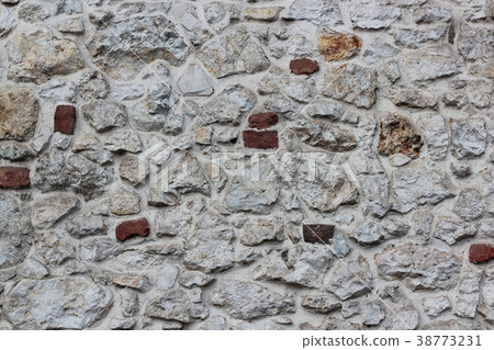 Old grey stone wall background texture close up. Old grey stone wall background texture close up. 38773231