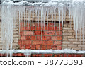 big icicles hang background old grunge brick wall 38773393