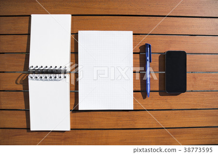 Empty white notepad with ballpoint pen and phone 38773595