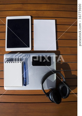 notepad with phone, laptop, headphones and tablet notepad with phone, laptop, headphones and tablet 38773600