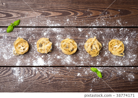 Pasta on an old wooden table. Close up Pasta on an old wooden table. Close up 38774171