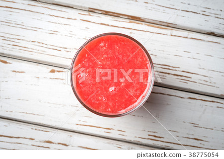 Grapefruit juice on white wooden table Grapefruit juice on white wooden table 38775054