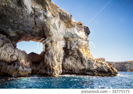 Window in a cliff at the seashore of Comino Island Window in a cliff at the seashore of Comino Island 38775575