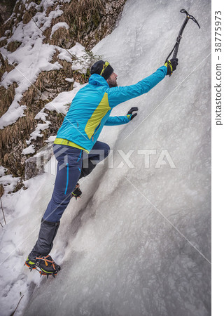 Climber on a frozen waterfall Climber on a frozen waterfall 38775973
