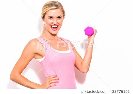 Woman working out with dumbbell 38776161