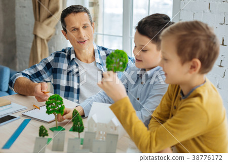 Young engineer telling his sons about landscape 38776172
