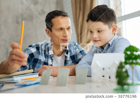 Pleasant father telling his son about alternative 38776196