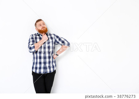 man with red hair and beard in plaid shirt man with red hair and beard in plaid shirt 38776273