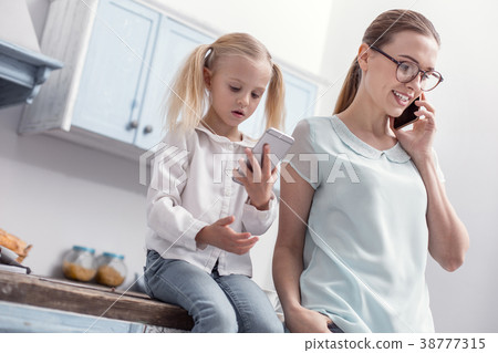 Pretty adorable girl and woman using gadgets 38777315