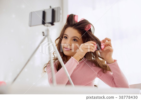 Charming beauty vlogger showing how to use hair 38778430