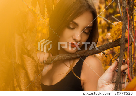 young girl with red lips and closed eyes posing in 38778526