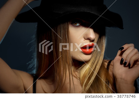 beautiful young girl with red lips and hat with 38778746