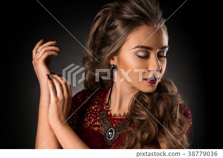 Charming young girl with beautiful curly hairstyle Charming young girl with beautiful curly hairstyle 38779036