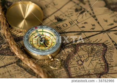 Old compass on vintage map with rope Old compass on vintage map with rope 38782966