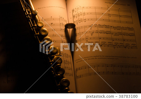 flute on an ancient music score background flute on an ancient music score background 38783100