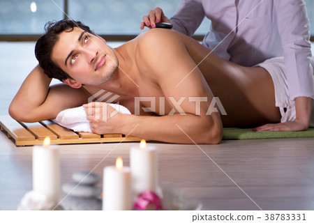 Young handsome man during spa procedure 38783331