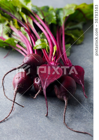 Beet, beetroot bunch on grey stone background. Beet, beetroot bunch on grey stone background. 38783583