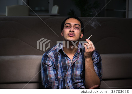 Young man in agony having problems with narcotics Young man in agony having problems with narcotics 38783628