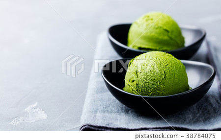 Matcha ice cream scoop in bowl Copy space. 38784075