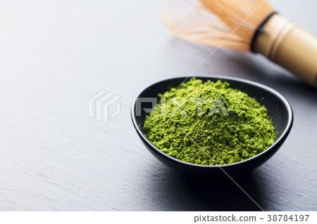 Matcha, green tea powder in bowl with bamboo whisk 38784197