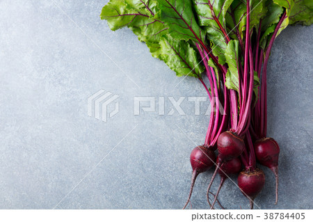 Beet, beetroot bunch on grey background Top view. Beet, beetroot bunch on grey background Top view. 38784405