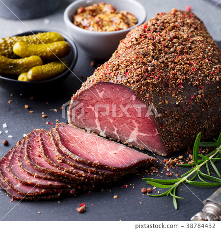 Roasted beef, pastrami on cutting board. Close up. 38784432