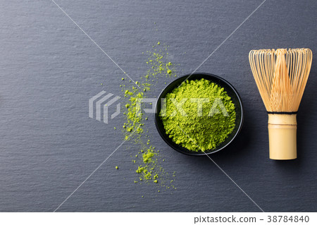 Matcha, green tea powder in black bowl Top view. Matcha, green tea powder in black bowl Top view. 38784840