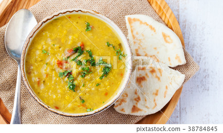 Lentil soup with pita bread in bowl. Top view. Lentil soup with pita bread in bowl. Top view. 38784845